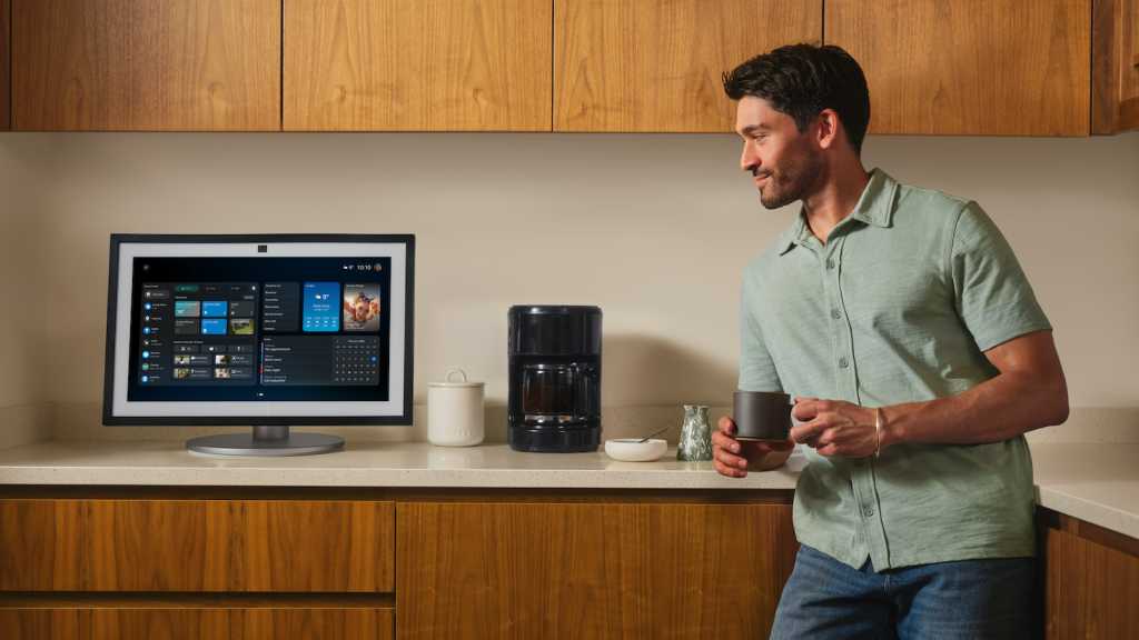 Alexa+ on a screen with a man standing next to it